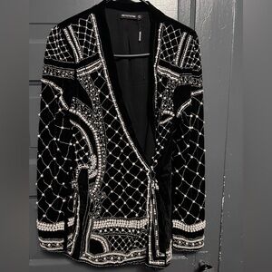 This is a bedazzled blazer. I wore it as a dress
